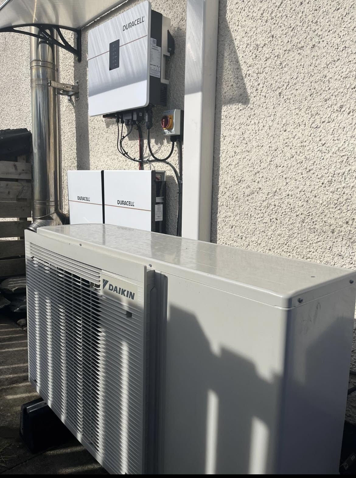 FLO heat pump installed alongside battery and inverter equipment