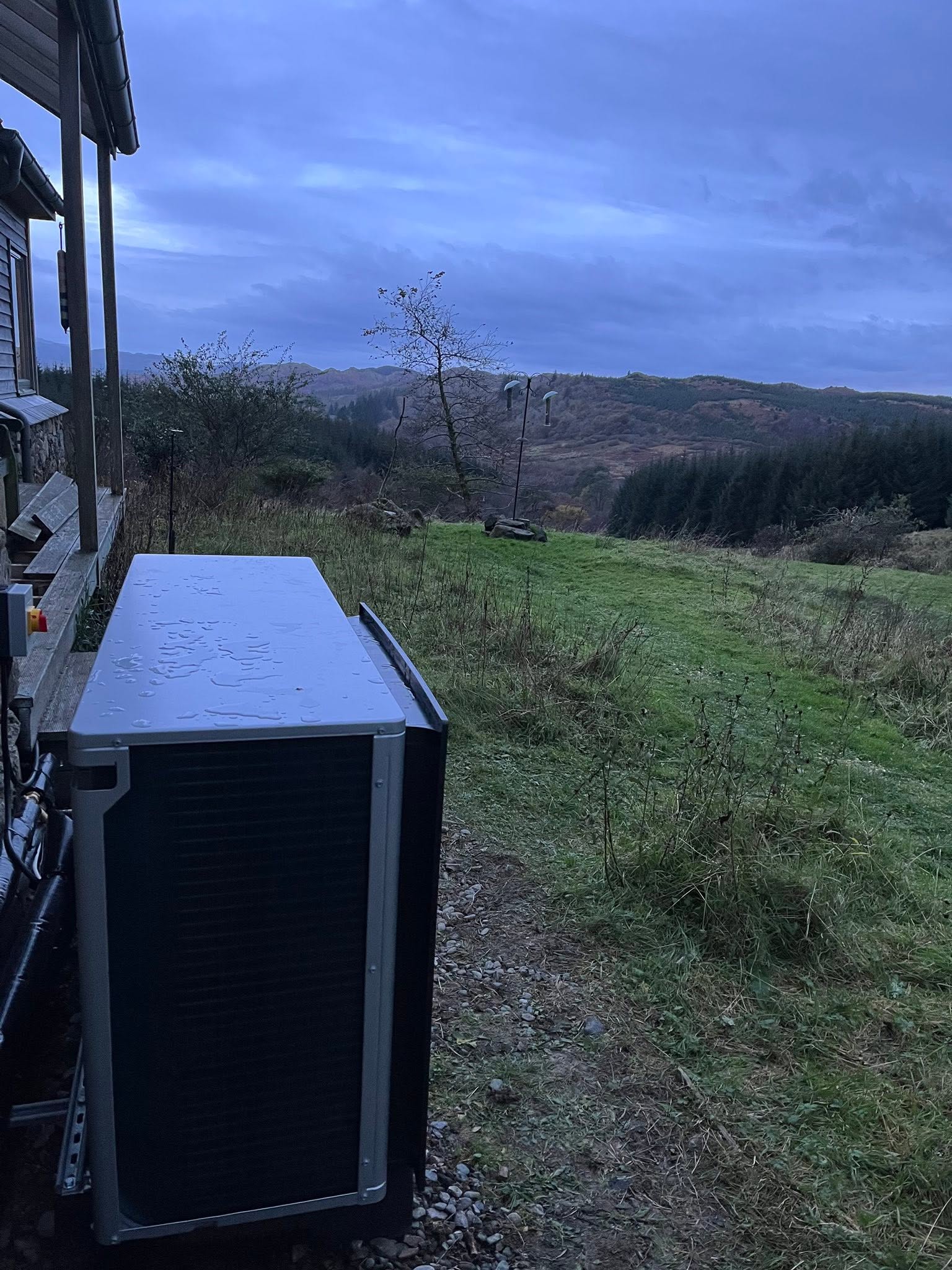 FLO air-source heat pump installed beside a rural Scottish home