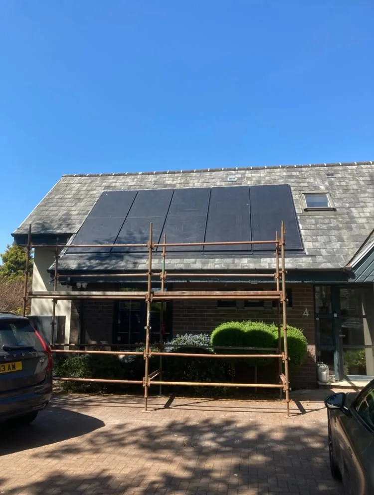 Solar panels being installed on a pitched roof