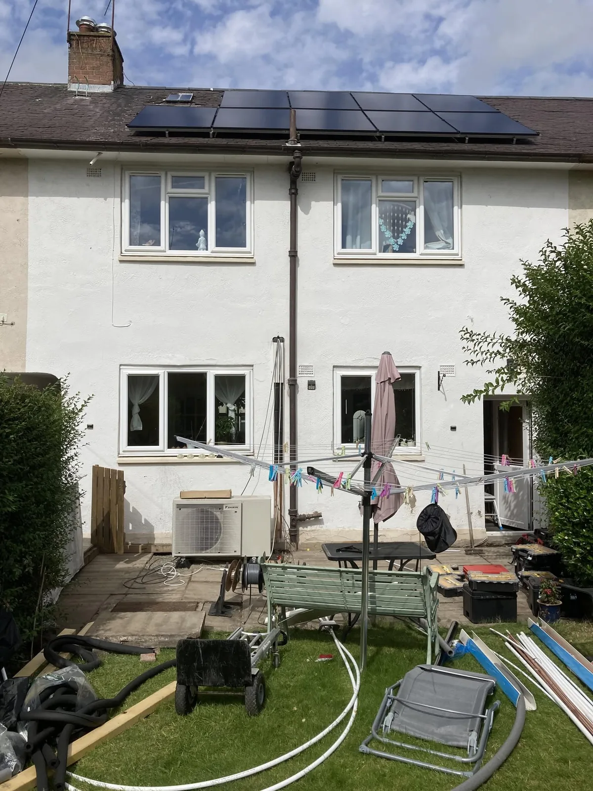 FLO solar panels and heat-pump equipment at the same terraced home